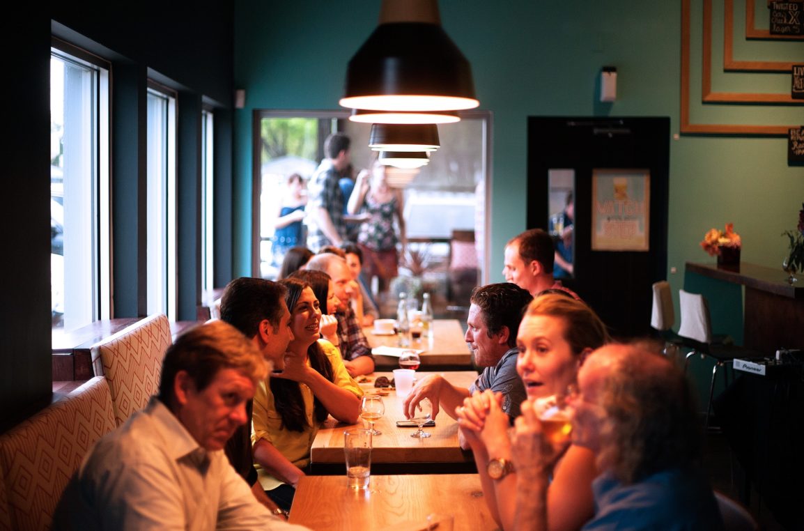 group conversation at long table